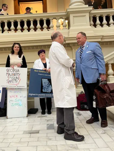 GC3GS co-chair Michael Greenwald is talking with a lawmaker at the capitol to promote the Pediatric Health Safe Storage Act