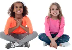 Two little girls sit next to each other looking at the camera. The image represents children who need to be protected from gun violence. 