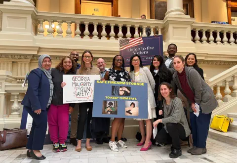 Georgia Majority for Gun Safety members pose at the Capitol with lawmakers supporting gun violence legilsation