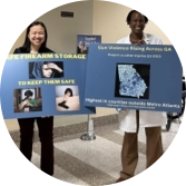 Doctors at the capitol holding posters about gun violence in Georgia